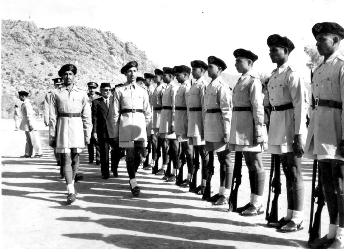 An officer inspecting a formed-up company at the College before 1970